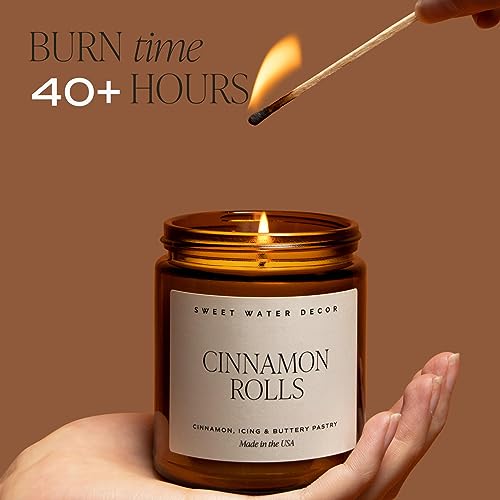 Sweet Water Decor Warm and Cozy Candle | Pine, Orange, Cinnamon, and Fir Balsam Winter Scented Soy Candles for Home | 9oz Amber Jar with Black Lid, 40 Hour Burn Time, Made in the USA